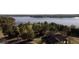 Stunning aerial view of a golf course with lake views and tree-lined fairways, showcasing the community's natural beauty at 155 Cottage Club Dr, Locust Grove, GA 30248