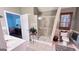 Clean bathroom featuring tiled floors, a glass shower, and natural light at 155 Cottage Club Dr, Locust Grove, GA 30248