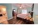 Well-lit bedroom with a connecting bathroom and a sliding door at 155 Cottage Club Dr, Locust Grove, GA 30248
