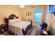 Cozy bedroom with carpet flooring, a ceiling fan, and a well-dressed bed at 155 Cottage Club Dr, Locust Grove, GA 30248