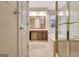 The primary bathroom features a jacuzzi tub, glass shower, and double sink vanity at 185 Newfield Dr, Tyrone, GA 30290
