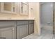 Bathroom featuring double vanity with granite countertop and stylish fixtures at 185 Newfield Dr, Tyrone, GA 30290