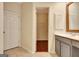 The bathroom features a large vanity with an open closet nearby at 185 Newfield Dr, Tyrone, GA 30290