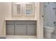 Bathroom featuring double vanity with granite countertop and stylish fixtures at 185 Newfield Dr, Tyrone, GA 30290