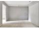 Cozy bedroom features neutral walls, carpet, and a closet, offering a serene and comfortable space at 185 Newfield Dr, Tyrone, GA 30290