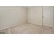 Bedroom features neutral walls, a white door, and neutral carpet at 185 Newfield Dr, Tyrone, GA 30290