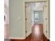 Bedroom view through doorway featuring hardwood flooring and natural light at 185 Newfield Dr, Tyrone, GA 30290