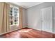 Bedroom featuring a large window that provides natural light and hardwood floors at 185 Newfield Dr, Tyrone, GA 30290