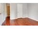 Neutral bedroom with hardwood floors and closet space at 185 Newfield Dr, Tyrone, GA 30290