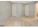 Spacious bedroom with neutral carpet, two closets, and a bright interior at 185 Newfield Dr, Tyrone, GA 30290
