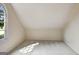 Bright room with sloped ceilings and window providing abundant natural light and neighborhood views at 185 Newfield Dr, Tyrone, GA 30290
