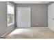 Neutral bedroom with closet and window provides a calming and comfortable space at 185 Newfield Dr, Tyrone, GA 30290