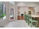 Breakfast nook with lots of light and access to the living room and backyard at 185 Newfield Dr, Tyrone, GA 30290