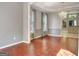 Open dining room features hardwood floors, elegant chandelier and views of the kitchen at 185 Newfield Dr, Tyrone, GA 30290