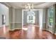 Elegant dining room with chandelier and large window at 185 Newfield Dr, Tyrone, GA 30290