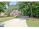 Red brick home with well-maintained lawn, long drive way and basketball hoop at 185 Newfield Dr, Tyrone, GA 30290