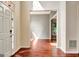 Bright foyer with hardwood flooring, neutral paint, and a glimpse into the adjacent living spaces at 185 Newfield Dr, Tyrone, GA 30290