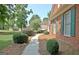 Brick home with manicured landscaping and a stone walkway at 185 Newfield Dr, Tyrone, GA 30290