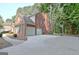 Spacious garage with basketball hoop and additional parking at 185 Newfield Dr, Tyrone, GA 30290