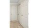 Hallway with three white doors and plush carpet, perfect for adding your personal style at 185 Newfield Dr, Tyrone, GA 30290