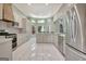 Large kitchen with stainless steel appliances, custom cabinetry and eat-in breakfast bar at 185 Newfield Dr, Tyrone, GA 30290