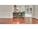 Kitchen with breakfast bar featuring white cabinets and stainless steel appliances at 185 Newfield Dr, Tyrone, GA 30290