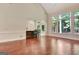 Open concept living room includes a breakfast bar, lots of natural light, and hardwood floors at 185 Newfield Dr, Tyrone, GA 30290