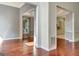 Elegant living room featuring hardwood floors, gray walls and trim, and decorative moldings at 185 Newfield Dr, Tyrone, GA 30290
