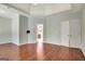 A spacious main bedroom has hardwood floors and features a tray ceiling and a bathroom at 185 Newfield Dr, Tyrone, GA 30290
