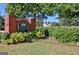 Brick neighborhood sign with landscaped garden, offering a welcoming entrance to the Estates at 185 Newfield Dr, Tyrone, GA 30290