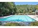 A spacious pool with clear blue water and ample lounge chairs for relaxation at 185 Newfield Dr, Tyrone, GA 30290