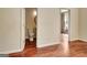 Convenient powder room with pedestal sink and hardwood floors at 185 Newfield Dr, Tyrone, GA 30290