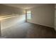 Bedroom featuring neutral walls, carpet and a window at 11045 Shadow Creek Ter # 65, Hampton, GA 30228