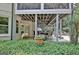 Back porch with seating and a view of the landscaped backyard, offering a peaceful outdoor retreat at 505 Lighthouse Ln, Peachtree City, GA 30269