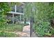 Backyard featuring a stone path leading to a pool area surrounded by lush foliage at 505 Lighthouse Ln, Peachtree City, GA 30269