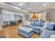 Open concept basement features a living area, ping pong table, bar area, and stairs to another level at 505 Lighthouse Ln, Peachtree City, GA 30269