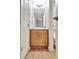 Bathroom with wood vanity and framed mirror, offering a clean and functional space at 505 Lighthouse Ln, Peachtree City, GA 30269