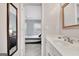 Bathroom view into bedroom with neutral wall paint, marble countertops, and tiled floors at 505 Lighthouse Ln, Peachtree City, GA 30269