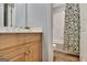 Well-lit bathroom with a wooden vanity and a view of the shower through a door at 505 Lighthouse Ln, Peachtree City, GA 30269