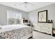 Bedroom features a large window, ceiling fan, and desk area with natural light at 505 Lighthouse Ln, Peachtree City, GA 30269