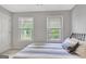 Bedroom with two large windows offering plenty of natural light and charming curb appeal at 505 Lighthouse Ln, Peachtree City, GA 30269