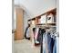 Walk-in closet featuring custom wooden shelving and ample storage space for clothes and accessories at 505 Lighthouse Ln, Peachtree City, GA 30269