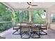 Inviting outdoor dining area with a large table, seating for eight, and a view of the lush greenery at 505 Lighthouse Ln, Peachtree City, GA 30269