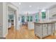 Open kitchen and breakfast nook with white cabinetry and stainless steel appliances at 505 Lighthouse Ln, Peachtree City, GA 30269