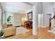 Cozy living room featuring hardwood floors, a comfortable sofa, and a piano at 505 Lighthouse Ln, Peachtree City, GA 30269