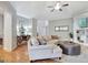 Cozy living room with vaulted ceilings, hardwood floors, and a comfortable sectional sofa at 505 Lighthouse Ln, Peachtree City, GA 30269