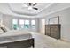 Spacious main bedroom with tray ceilings, carpet and large windows at 505 Lighthouse Ln, Peachtree City, GA 30269