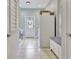 Bright mudroom with a tile floor, bench with drawers, utility closet and an exterior door with glass at 505 Lighthouse Ln, Peachtree City, GA 30269