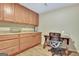 Office space with wood cabinets and desk, perfect for a dedicated workspace at 505 Lighthouse Ln, Peachtree City, GA 30269