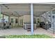 Inviting outdoor space with a hot tub, dining area, and staircase to the upper level at 505 Lighthouse Ln, Peachtree City, GA 30269